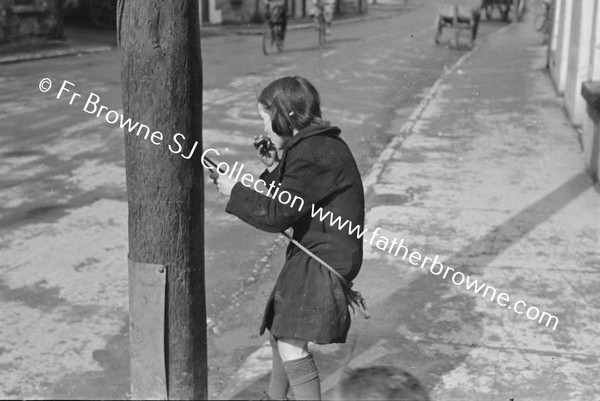 GIRL PLAYING IN STREET